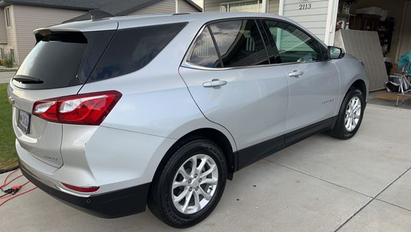Silver SUV exterior detailed clean by Next Mile Enterprises mobile detailing in Houston